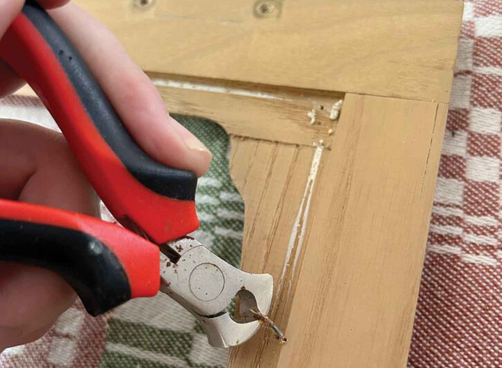 Removing a staple with pliers