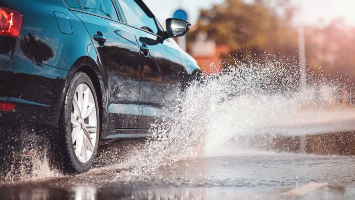 A car creating spray as it's driven