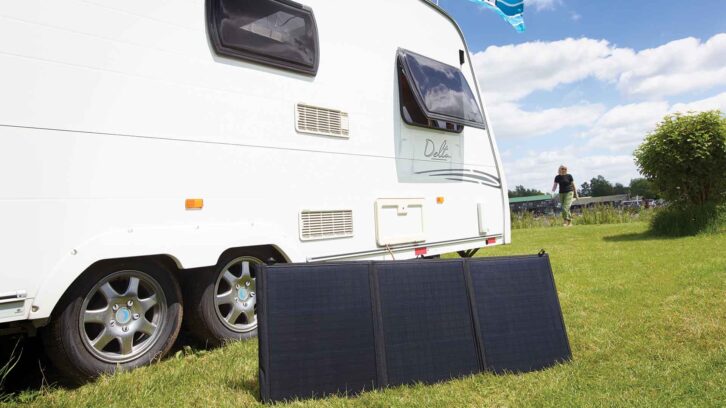 A freestanding panel by a caravan