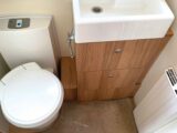 The cassette toilet and the basin in the washroom