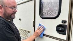 Nigel Donnelly in the act of polishing a caravan