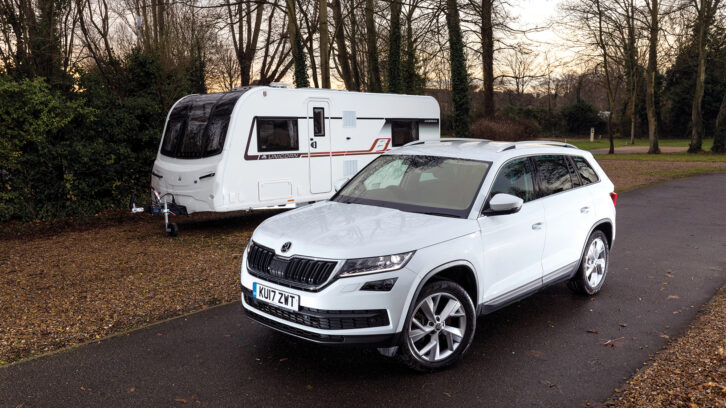 A used Škoda Kodiaq by a caravan