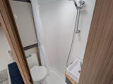 The shower in the corner washroom