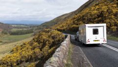 A caravan being towed down a country road