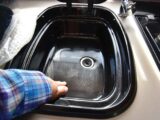 The scratched black sink