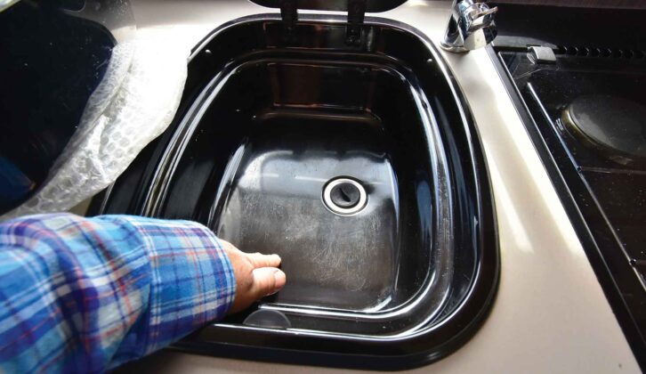 The scratched black sink