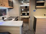 The l-shaped kitchen and rear island bed in the Portifino