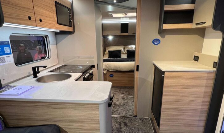 The l-shaped kitchen and rear island bed in the Portifino