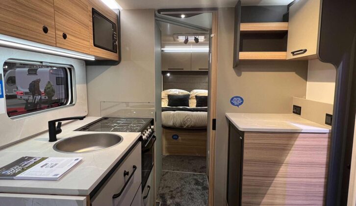 The kitchen and rear island bed in the Bailey Phoenix Black Edition 640