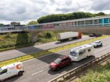 A caravan being towed on a motorway