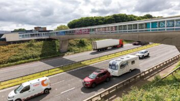 A caravan being towed on a motorway