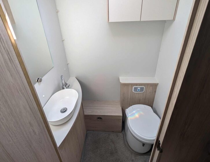 The toilet and basin in the washroom