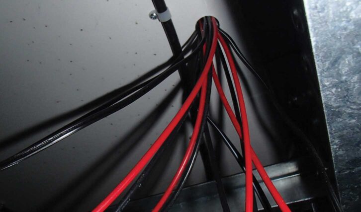 The cables passing through the hole