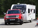 A Jeep Renegade towing a caravan