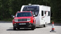 A Jeep Renegade towing a caravan