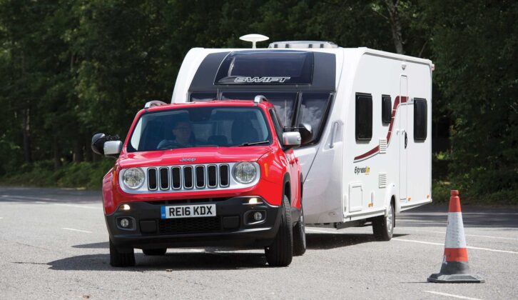 A Jeep Renegade towing a caravan