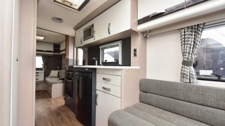 The sofa and the kitchen