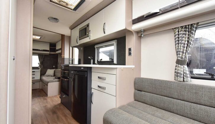 The sofa and the kitchen