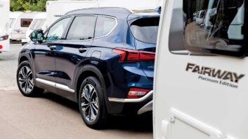A car hitched up to a caravan