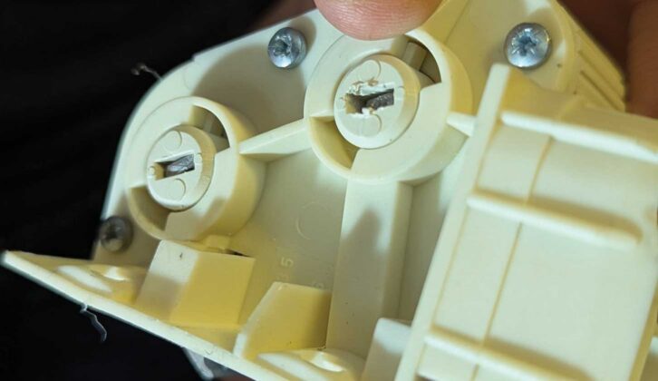 The tensioner back in its holder