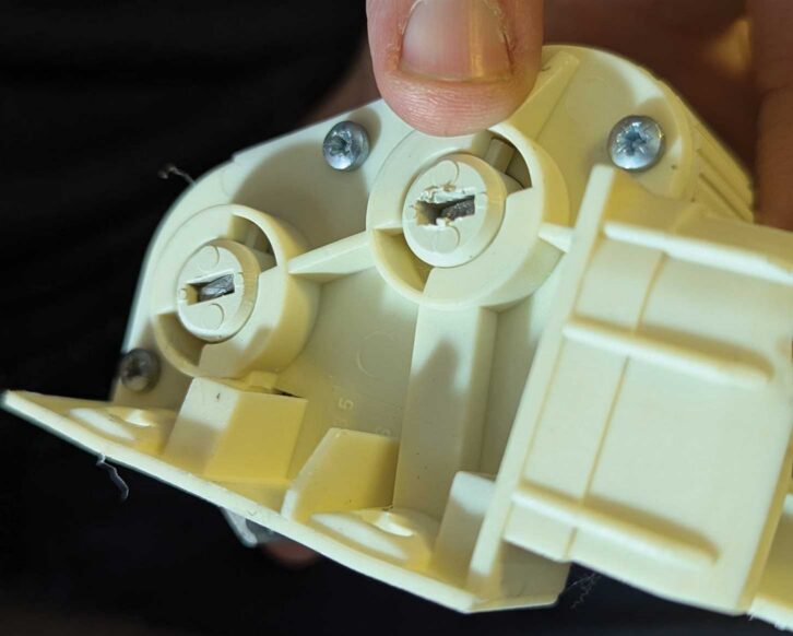 The tensioner back in its holder