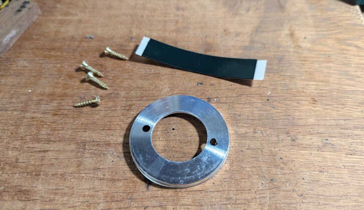 The sticky pad, screws and base plate