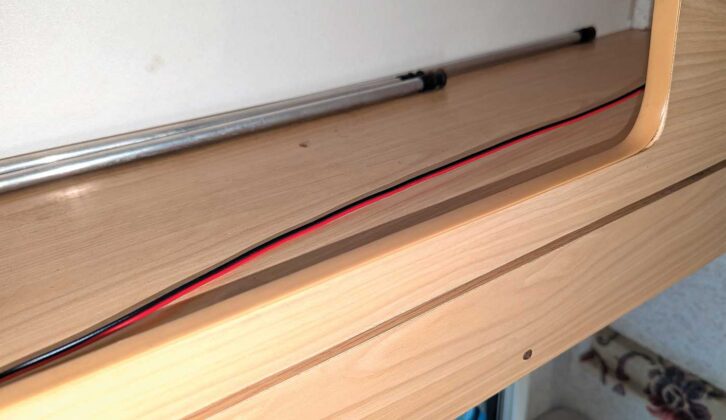 The cable running through the cabinets