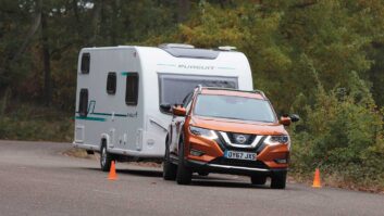 A Nissan X-Trail Mk3 towing a caravan