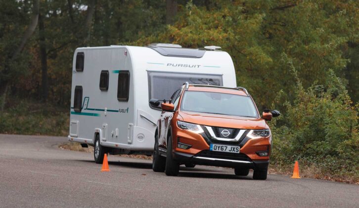 A Nissan X-Trail Mk3 towing a caravan
