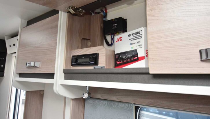 The JVC radio in an upper locker
