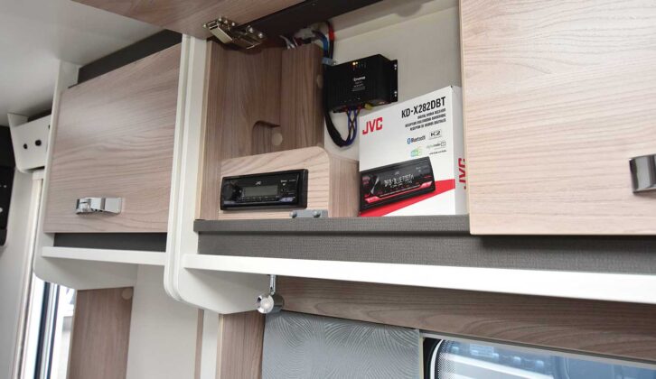 The JVC radio in an upper locker