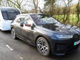 A BMW iX towing a caravan