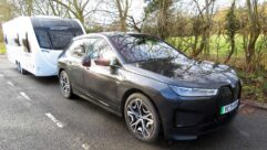 A BMW iX towing a caravan