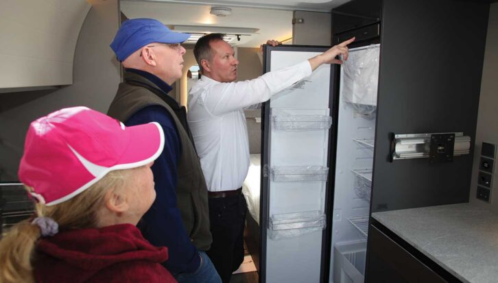 Showing a couple the fridge 