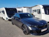 The BMW 530e M Sport Pro Touring hitched up to a caravan