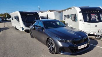 The BMW 530e M Sport Pro Touring hitched up to a caravan