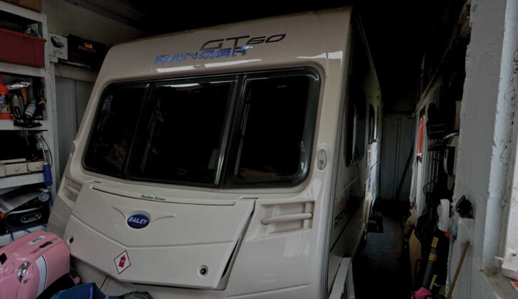 A caravan surrounded by clutter