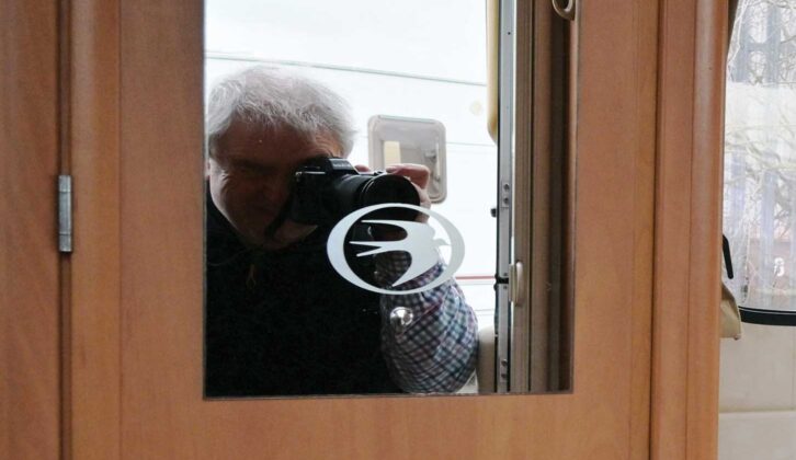 The blurry reflection of a person's outline in a mirror