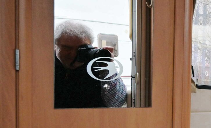 The blurry reflection of a person's outline in a mirror