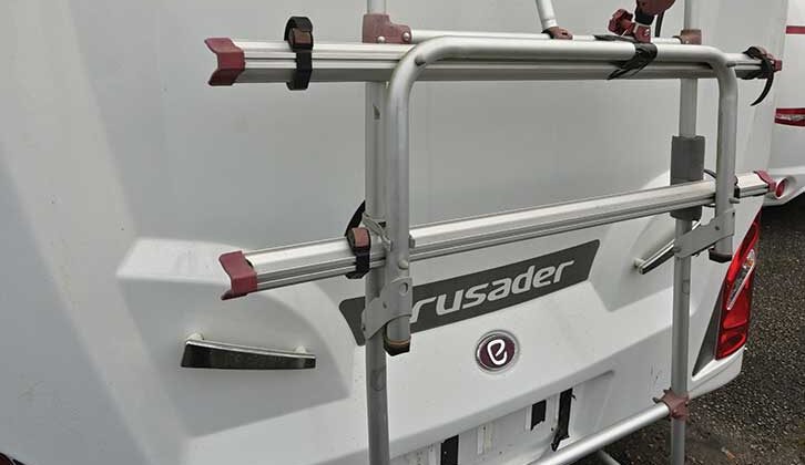 A bike rack on the back of a caravan