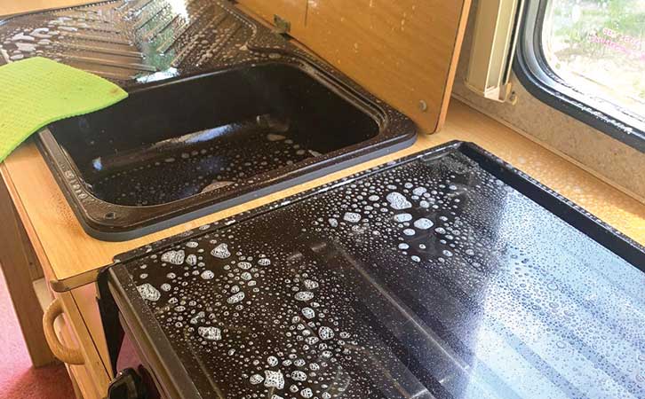 A kitchen with cleaning solution on it