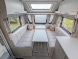 The lounge with the table in between the parallel settees