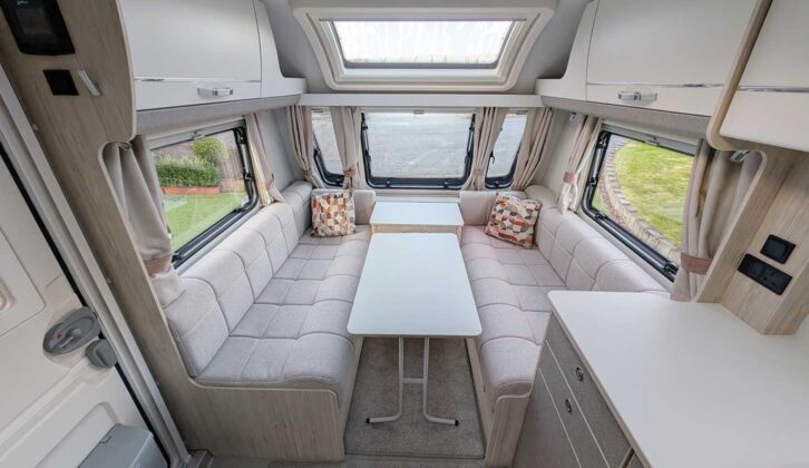 The lounge with the table in between the parallel settees