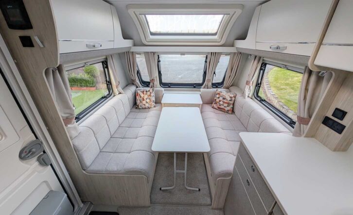 The lounge with the table in between the parallel settees