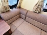 A close-up of one of the sofas and the curtains