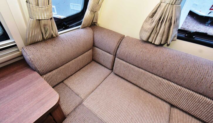A close-up of one of the sofas and the curtains