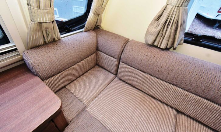 A close-up of one of the sofas and the curtains