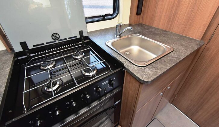 The four-burner hob and the sink in the kitchen