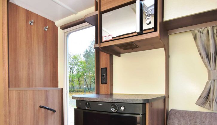 The microwave above the fridge