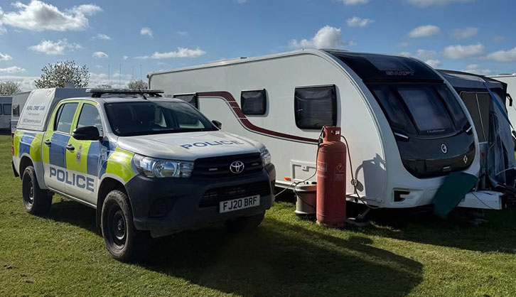 The caravan by a police car
